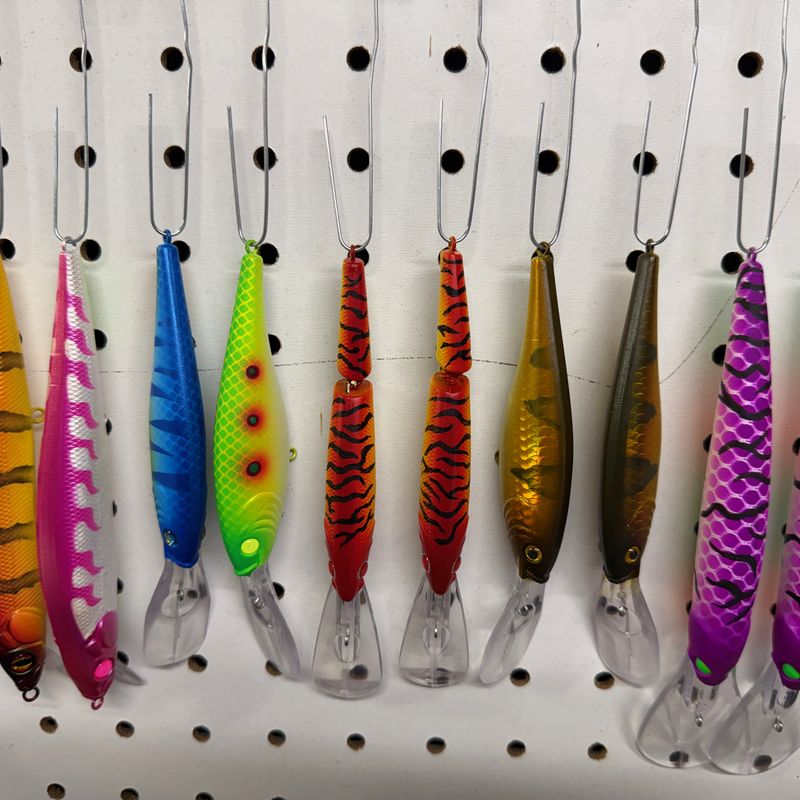 A rack of hand-painted ABEco baits