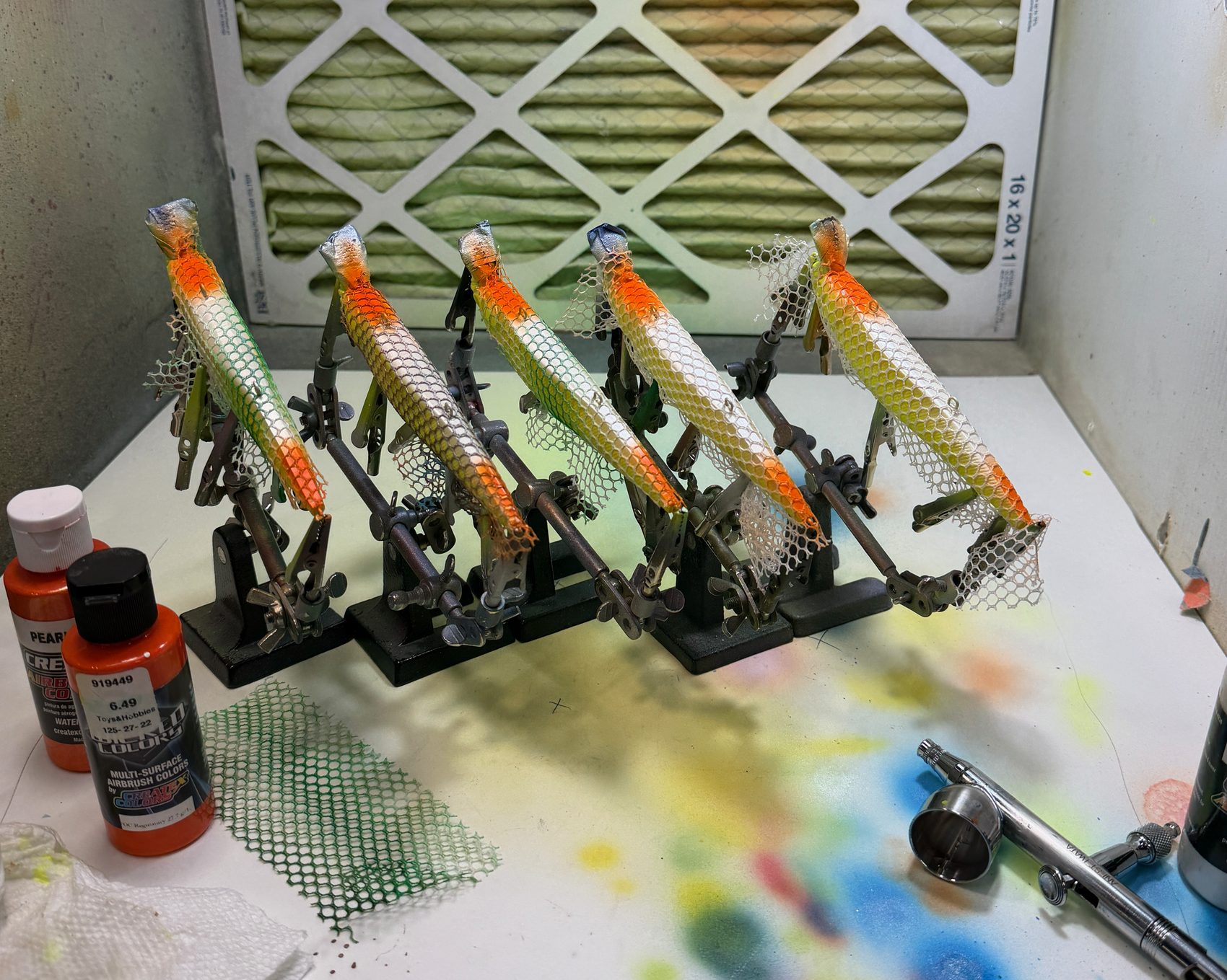 ABEco baits on stands in the airbrush booth, mesh-scale work in progress